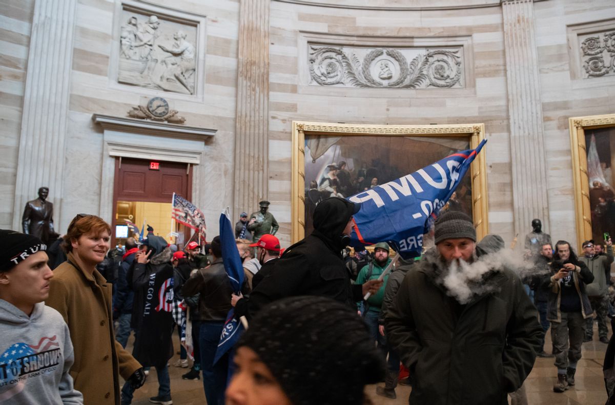 (FILES) Supporters of US President Donald Trump walk around in the Rotunda after breaching the US Capitol in Washington, DC, January 6, 2021. - Demonstrators breeched security and entered the Capitol as Congress debated the 2020 presidential election Electoral Vote Certification. (Photo by SAUL LOEB / AFP) (Photo by SAUL LOEB/AFP via Getty Images) (Photo by SAUL LOEB/AFP via Getty Images)