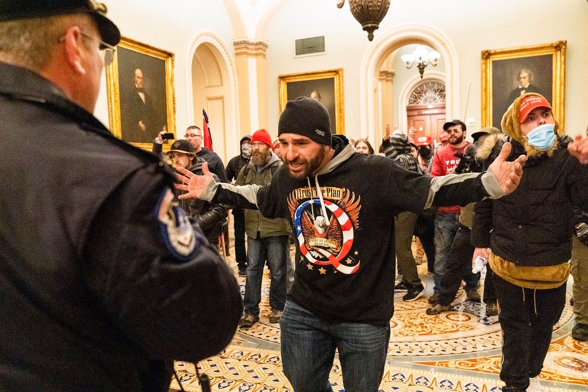 Supporters of President Donald Trump are confronted by Capitol Police officers outside the Senate Chamber at the Capitol, Wednesday, Jan. 6, 2021 in Washington. (AP Photo/Manuel Balce Ceneta) (AP Photo/Manuel Balce Ceneta)