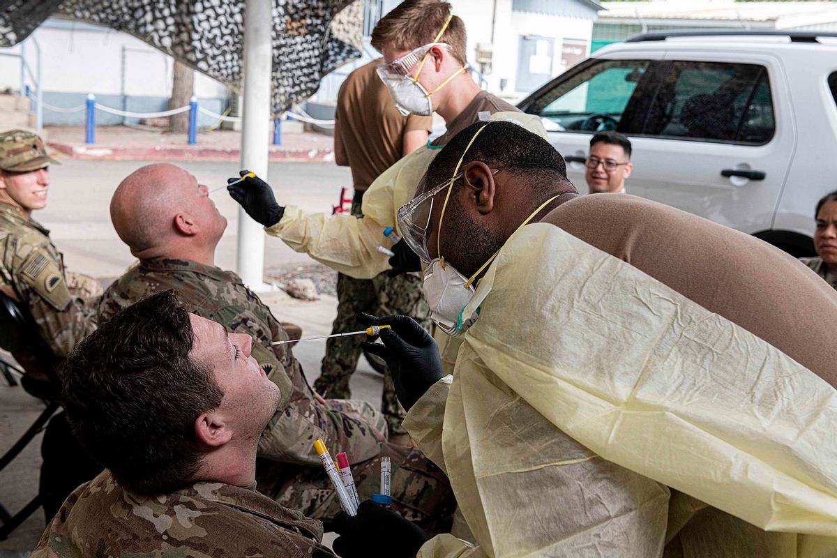 U.S. Navy hospital corpsmen assigned to Michaud Expeditionary Medical Facility, test U.S. Army Soldiers from Charlie Company, 1-186th Infantry Battalion, Task Force Guardian, Combined Joint Task Force - Horn of Africa, for COVID-19 during a routine screening at Camp Lemonnier, Djibouti, April 26, 2020. (U.S. Navy photo by Chief Mass Communication Specialist Elisandro T. Diaz) (Navy Medicine / Wikimedia Commons)