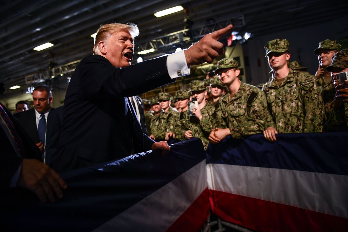 US President Donald Trump greets Marines aboard the amphibious assault ship USS Wasp (LHD 1) during a Memorial Day event in Yokosuka on May 28, 2019. (Photo by Brendan SMIALOWSKI / AFP)        (Photo credit should read BRENDAN SMIALOWSKI/AFP via Getty Images) (Getty Images)