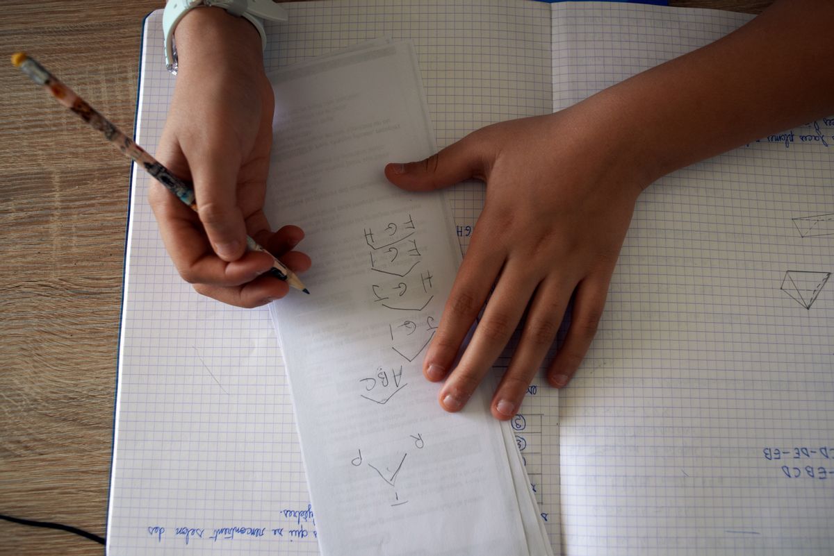 A pupil does maths on a notebook. For the 7th day, French people are on lockdown. Schools, highschools, universities are closed since March 13th. French Education minister Jean-Michel Blanquertold teachers to give online courses. Parents and children must interact to work together and for children to do their homeworks and receive online courses. They use videoconference and e-learning. Toulouse. France. March 24th 2020. (Photo by Alain Pitton/NurPhoto via Getty Images) (Getty Images)