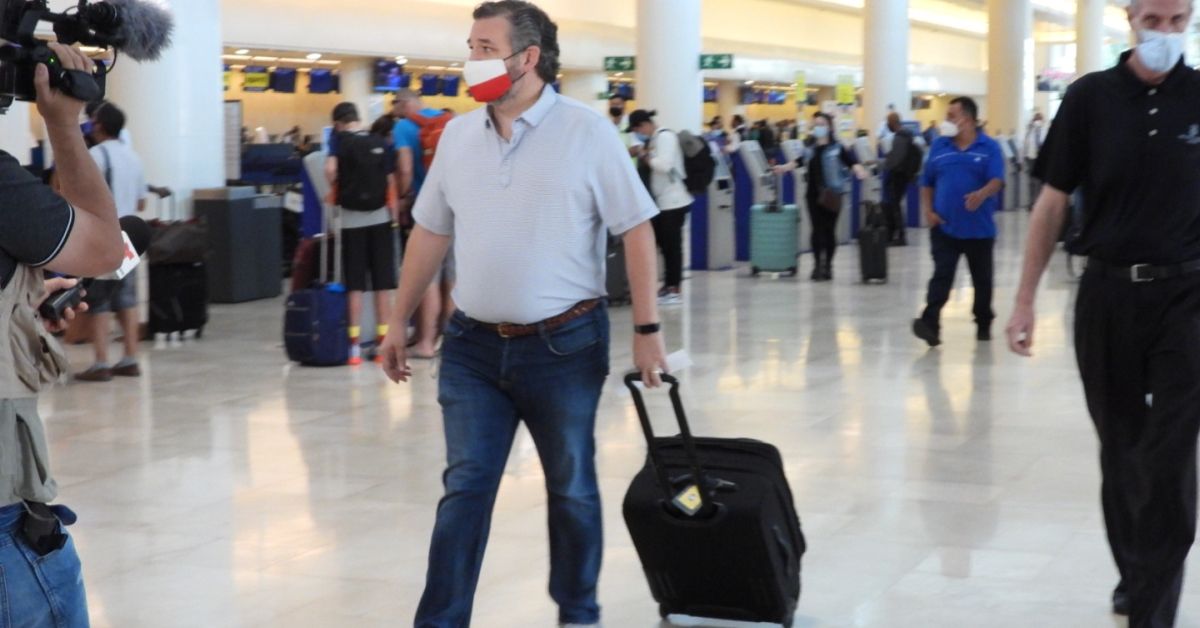 CANCUN, MEXICO - FEBRUARY 18: Sen. Ted Cruz (R-TX) checks in for a flight at Cancun International Airport after a backlash over his Mexican family vacation as his home state of Texas endured a Winter storm on February 18, 2021 in Cancun, Quintana Roo, Mexico. The Republican politician came under fire after leaving for the warm holiday destination as hundreds of thousands of people in the lone star state suffered a loss of power. Reports stated that Cruz was due to catch a flight back to Houston, Texas. (Photo by MEGA/GC Images) (MEGA/GC Images )
