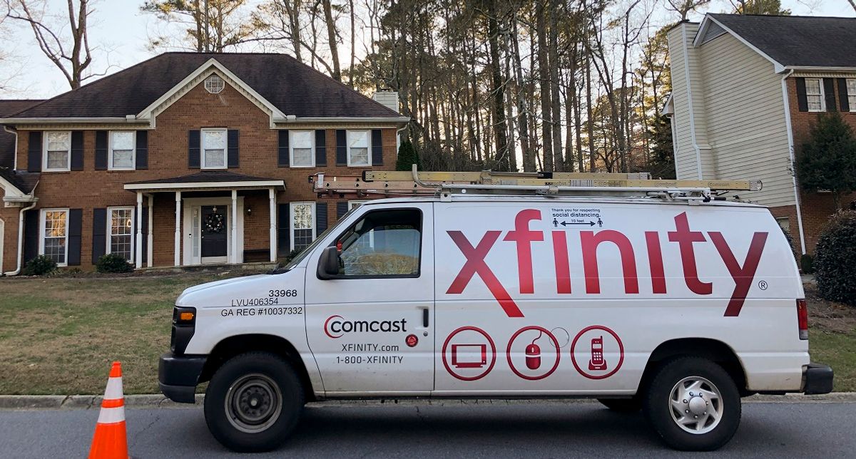 A Comcast van sits in front of a residence on Dec. 26, 2020, in Kennesaw, Ga. (AP Photo/Mike Stewart) (AP Photo/Mike Stewart)