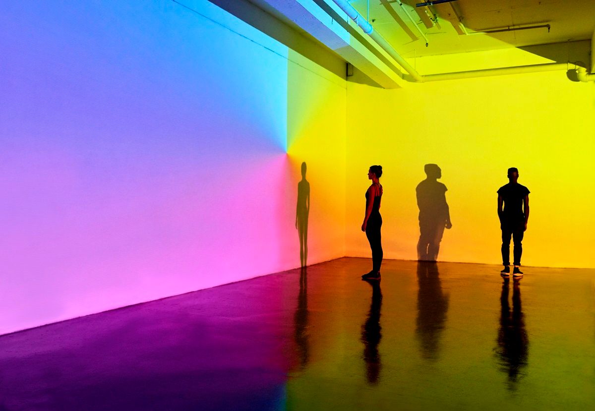 man and woman standing in a gallery space with colourful walls (Mads Perch/Stone via Getty Images)