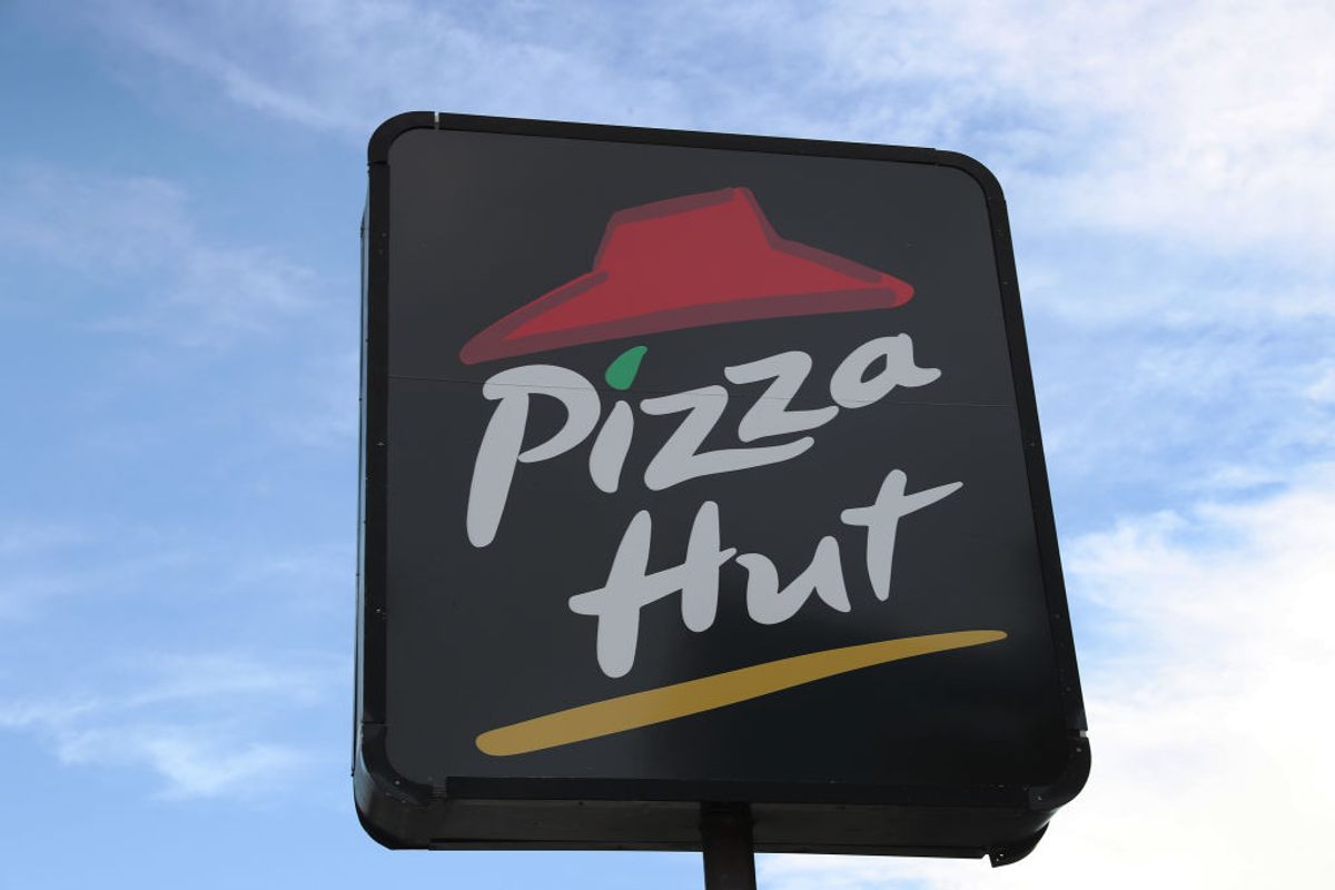 MIAMI, FLORIDA - AUGUST 17: A sign is seen at a Pizza Hut restaurant on August 17, 2020 in Miami, Florida. NPC International announced it had reached an agreement with Yum! Brands, the parent company of Pizza Hut, to close approximately 300 Pizza Hut locations after it filed for bankruptcy.  (Photo by Joe Raedle/Getty Images) (Joe Raedle / Getty Images)