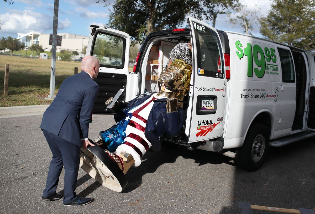 ORLANDO, FLORIDA - FEBRUARY 27: Matt Braynard (L) helps artist Tommy Zegan (R) load his statue of former President Donald Trump into a van during the Conservative Political Action Conference on February 27, 2021 in Orlando, Florida. Begun in 1974, CPAC brings together conservative organizations, activists, and world leaders to discuss issues important to them.  (Photo by Joe Raedle/Getty Images) (Joe Raedle/Getty Images)