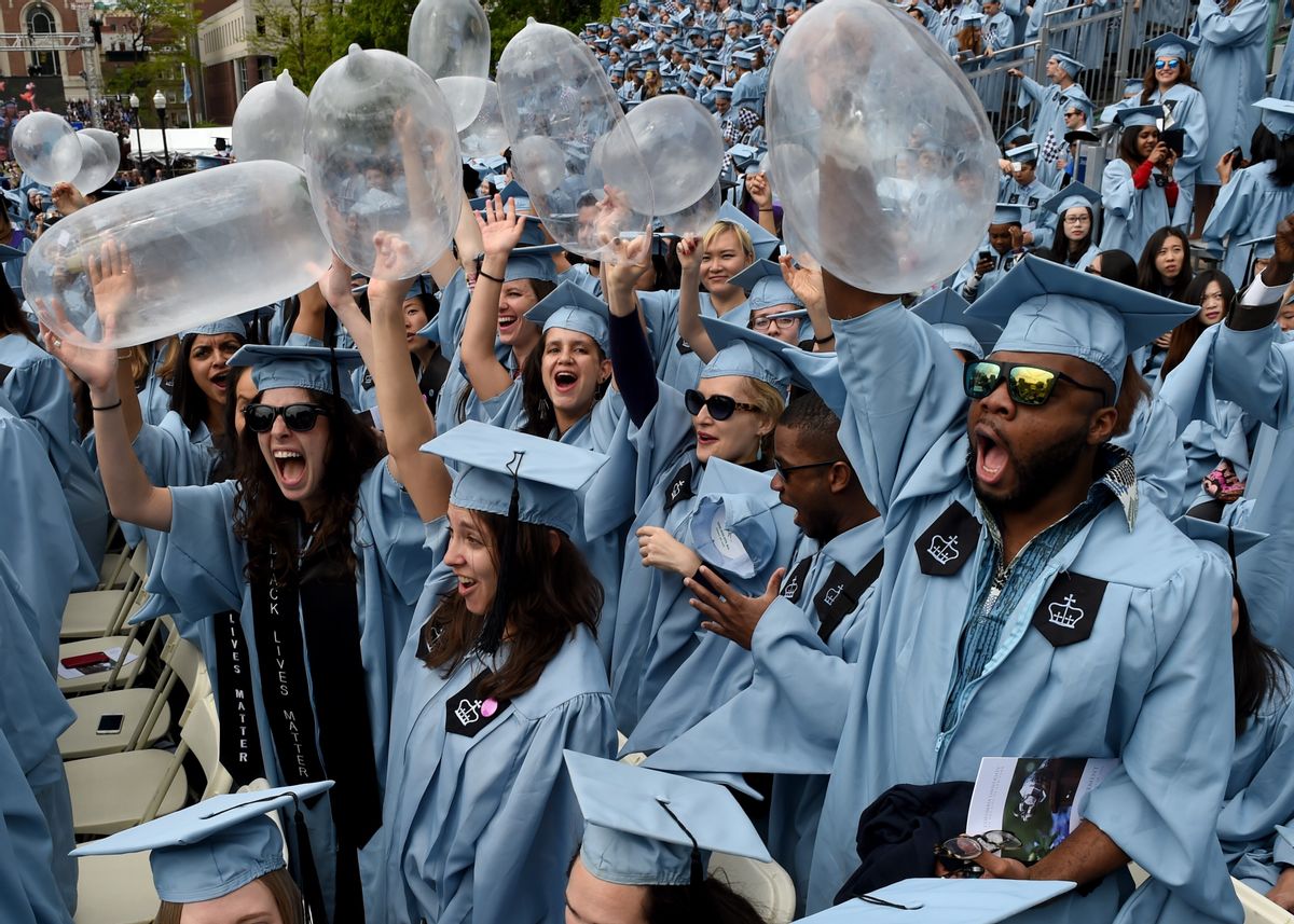 Graduating students from Columbia University's Mailman School of Public Health hold up inflated condoms during the Columbia University 2016 Commencement ceremony in New York May 18, 2016. / AFP / TIMOTHY A. CLARY        (Photo credit should read TIMOTHY A. CLARY/AFP via Getty Images) (Getty Images)