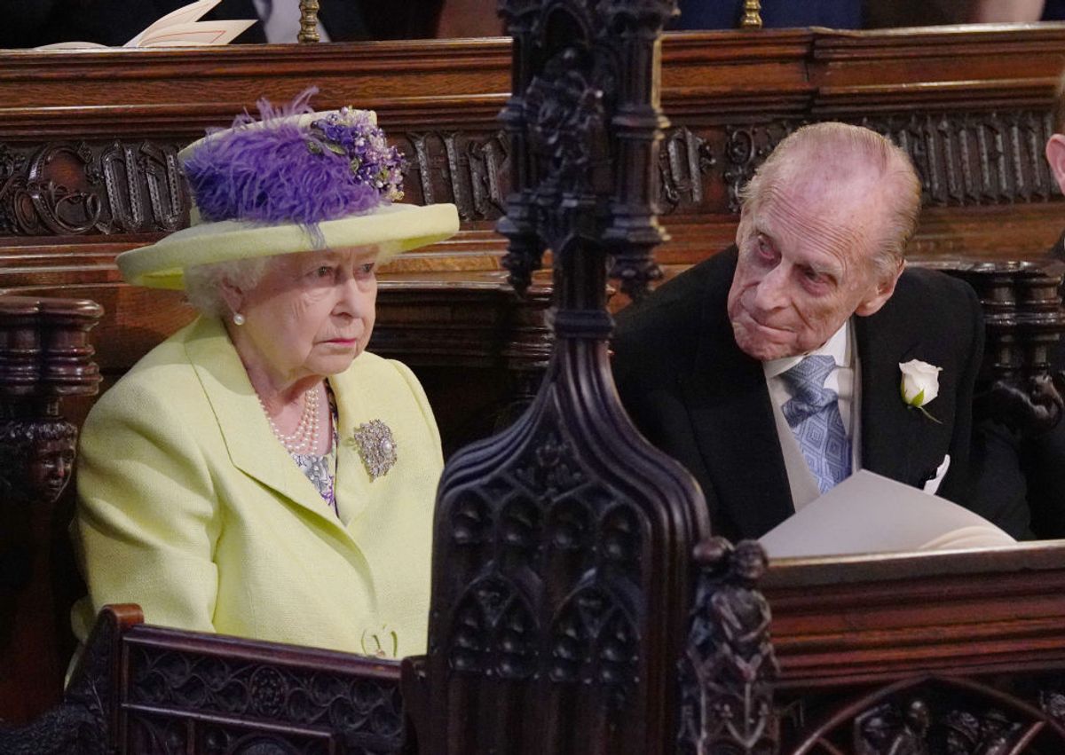 Britain's Queen Elizabeth II and Britain's Prince Philip, Duke of Edinburgh (R) during the wedding ceremony of Britain's Prince Harry, Duke of Sussex and US actress Meghan Markle in St George's Chapel, Windsor Castle, in Windsor, on May 19, 2018. (Photo by Jonathan Brady / POOL / AFP) (Photo by JONATHAN BRADY/POOL/AFP via Getty Images) (JONATHAN BRADY / Getty Images)