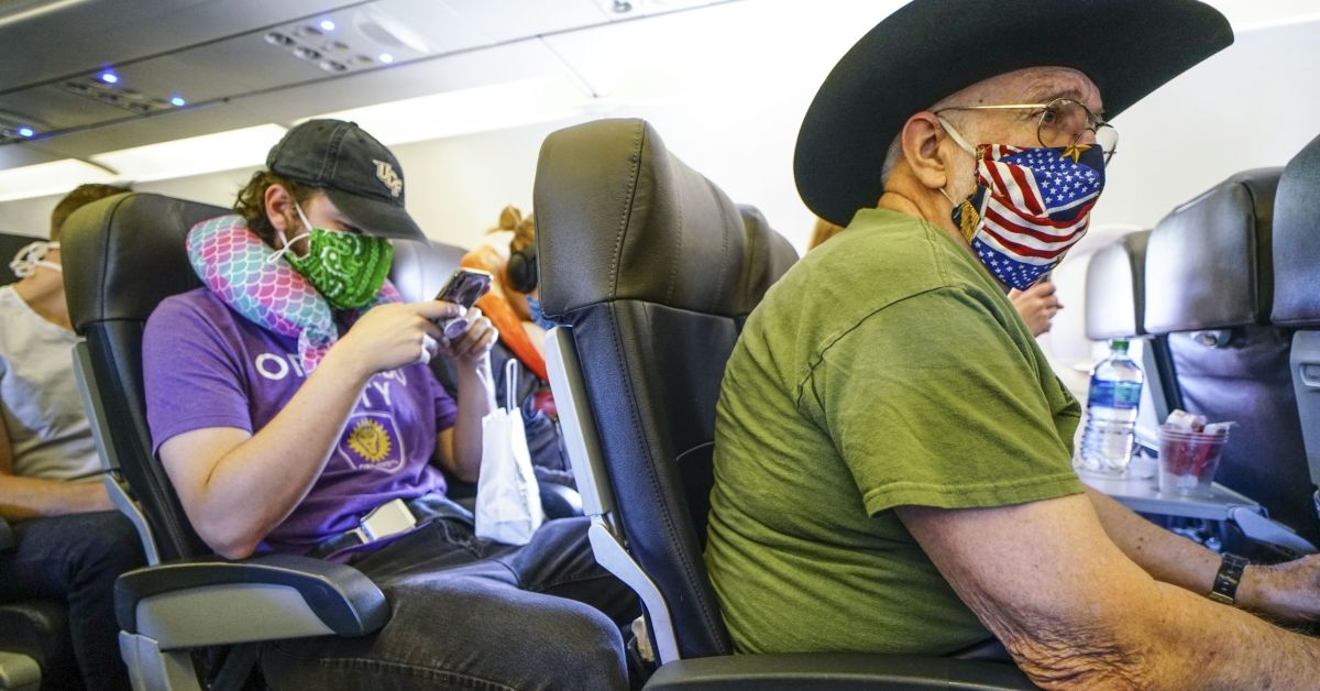 SAN DIEGO, CA - MAY 20:  Passengers onboard an American Airlines flight to Charlotte, NC at San Diego International Airport on May 20, 2020 in San Diego, California. Air travel is down as estimated 94 percent due to the coronavirus (COVID-19) pandemic, causing U.S. airlines to take a major financial hit with losses of $350 million to $400 million a day and nearly half of major carriers airplanes are sitting idle. (Photo by Sandy Huffaker/Getty Images) (Getty Images)