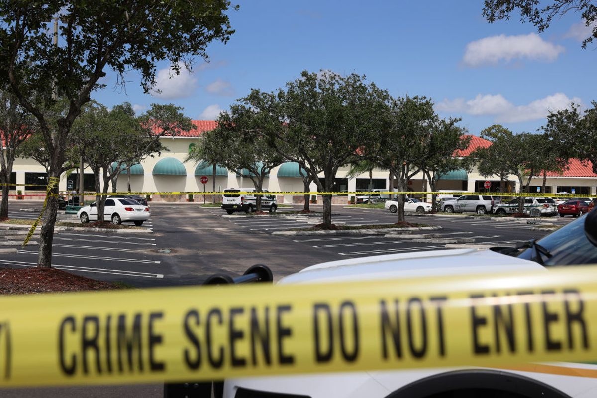 ROYAL PALM BEACH, FLORIDA - JUNE 10: Palm Beach County Sheriff’s crime scene tape is seen outside of a Publix supermarket where a woman,  child and a man were found shot to death on June 10, 2021 in Royal Palm Beach, Florida. Law enforcement officials continue to investigate the crime scene for clues as to why the shooting occurred. (Photo by Joe Raedle/Getty Images) (Getty Images)
