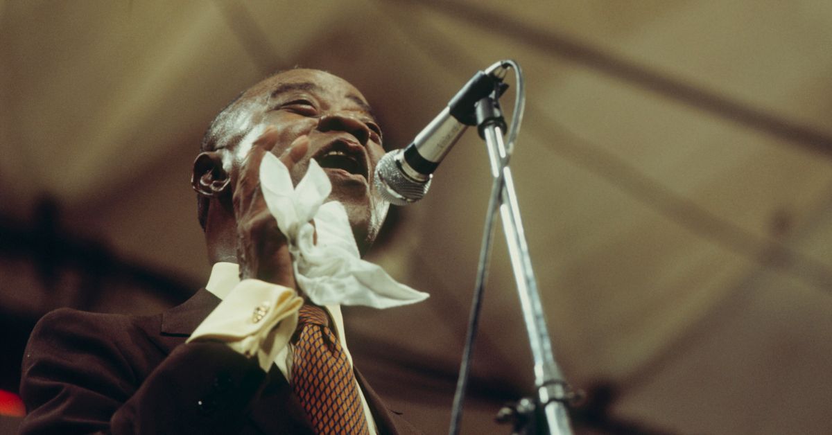 American jazz trumpeter and vocalist Louis Armstrong (1901-1971) performs live on stage at the Newport Jazz Festival in Newport, Rhode Island on 10th July 1970. (Photo by David Redfern/Redferns) (David Redfern/Redferns/Getty Images)