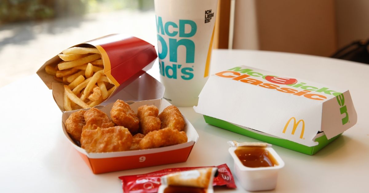 28 June 2019, Berlin: A cardboard box with Chicken McNuggets, McChicken Burger, a beverage cup with a soft drink, a bag with tomato ketchup and French fries. The fast food chain McDonald's wants to produce less plastic waste. For example, desserts are to be sold in the course of the coming year in more sustainable packaging "almost without plastic". Already this year plastic holders for balloons would be abolished, McDonald's announced. From 2021 they will no longer be allowed to be sold in the EU - as will disposable cutlery and plates and plastic straws. Photo: Gerald Matzka/dpa-Zentralbild/ZB (Photo by Gerald Matzka/picture alliance via Getty Images) (Gerald Matzka/picture alliance via Getty Images)