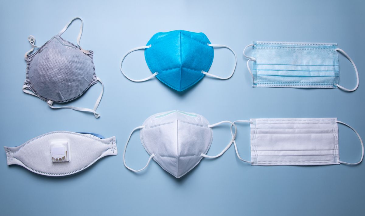 different types of protective face mask against blue background (Kilito Chan)