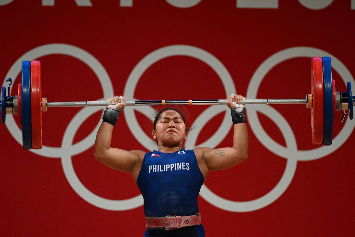Philippines' Hidilyn Diaz competes in the women's 55kg weightlifting competition during the Tokyo 2020 Olympic Games at the Tokyo International Forum in Tokyo on July 26, 2021. (Photo by Vincenzo PINTO / AFP) (Photo by VINCENZO PINTO/AFP via Getty Images) (Getty Images)
