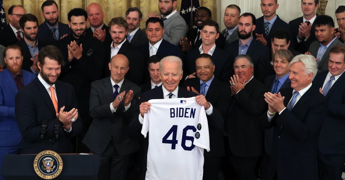 WASHINGTON, DC - JULY 02: U.S. President Joe Biden (C) holds the jersey given to him by Los Angeles Dodgers Chairman Mark Walter during an event with the 2020 World Series champions in the East Room of the White House on July 02, 2021 in Washington, DC. The Dodgers defeated the Tampa Bay Rays to win the championship series at the end of an abbreviated season due to the coronavirus. (Photo by Chip Somodevilla/Getty Images) (Photo by Chip Somodevilla/Getty Images)