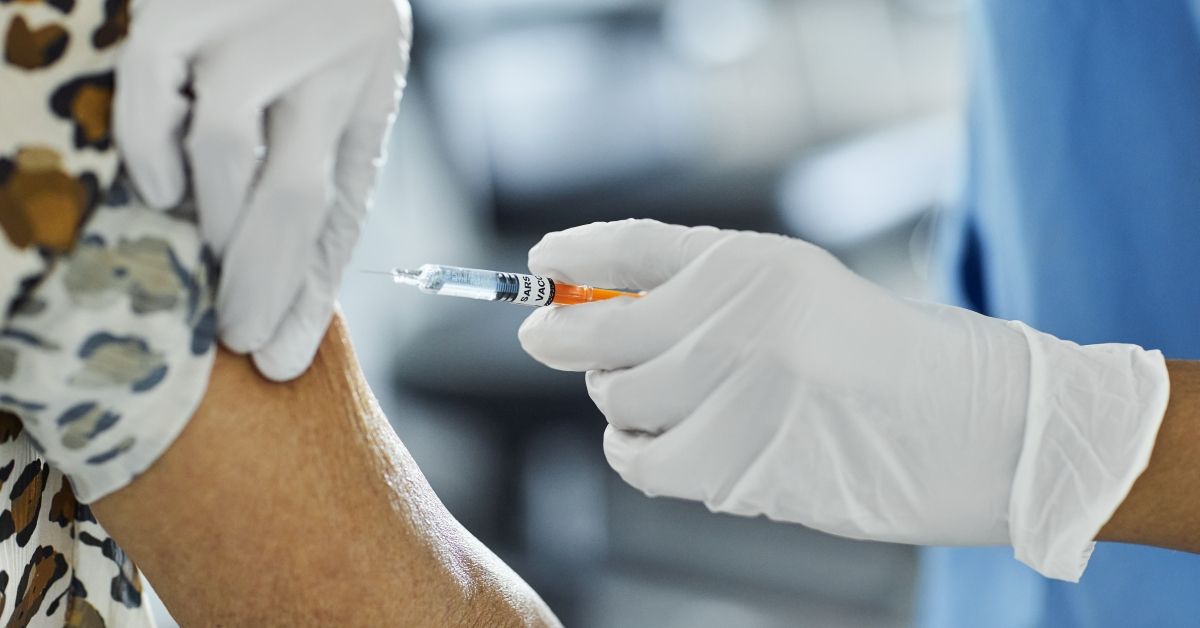 Cropped image of nurse injecting Covid-19 Vaccine to a patient. Female healthcare worker is working at hospital. She is holding syringe. (Getty Images)