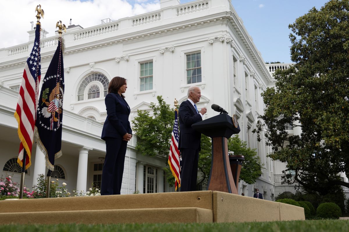 WASHINGTON, DC - MAY 13: U.S. President Joe Biden delivers remarks on the COVID-19 response and vaccination program as Vice President Kamala Harris listens in the Rose Garden of the White House on May 13, 2021 in Washington, DC. The Centers for Disease Control and Prevention (CDC) announced today that fully vaccinated people will no longer need to wear masks or socially distance for indoor and outdoor activities in most settings. (Photo by Alex Wong/Getty Images) (Alex Wong/Getty Images)