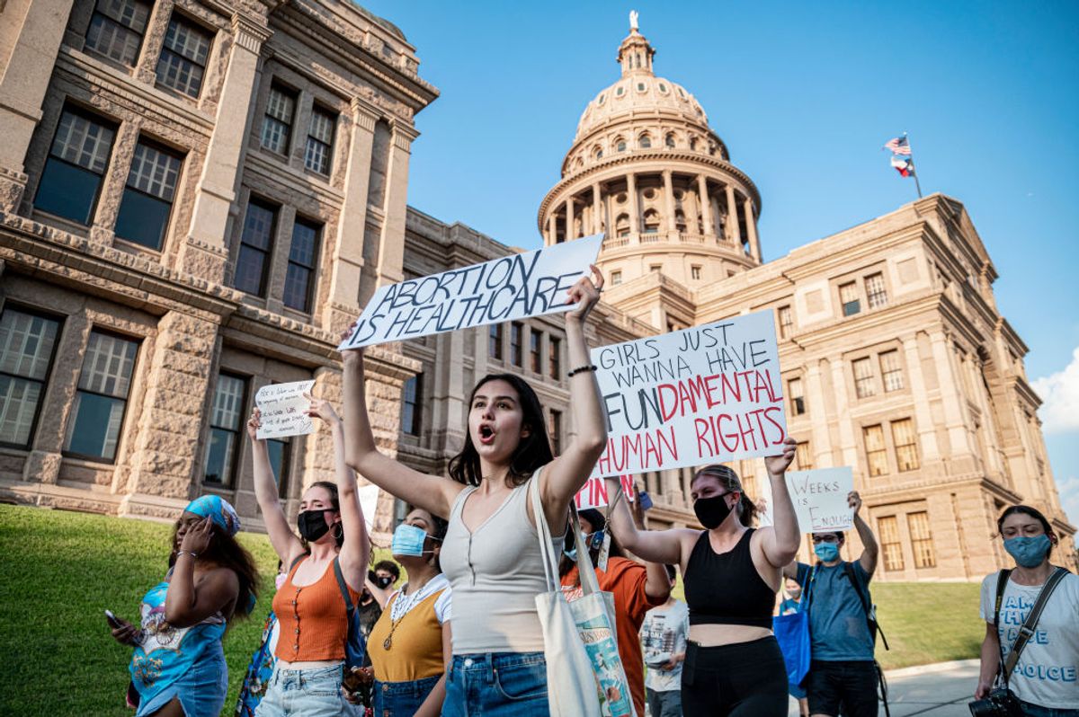 AUSTIN, TX - SEPT 1: Pro-choice protesters march outside the Texas State Capitol on Wednesday, Sept. 1, 2021 in Austin, TX. Texas passed SB8 which effectively bans nearly all abortions and it went into effect Sept. 1. A request to the Supreme Court to block the bill went unanswered and the Court still has yet to take any action on it. (Sergio Flores For The Washington Post via Getty Images) (Sergio Flores For The Washington Post via Getty Images)