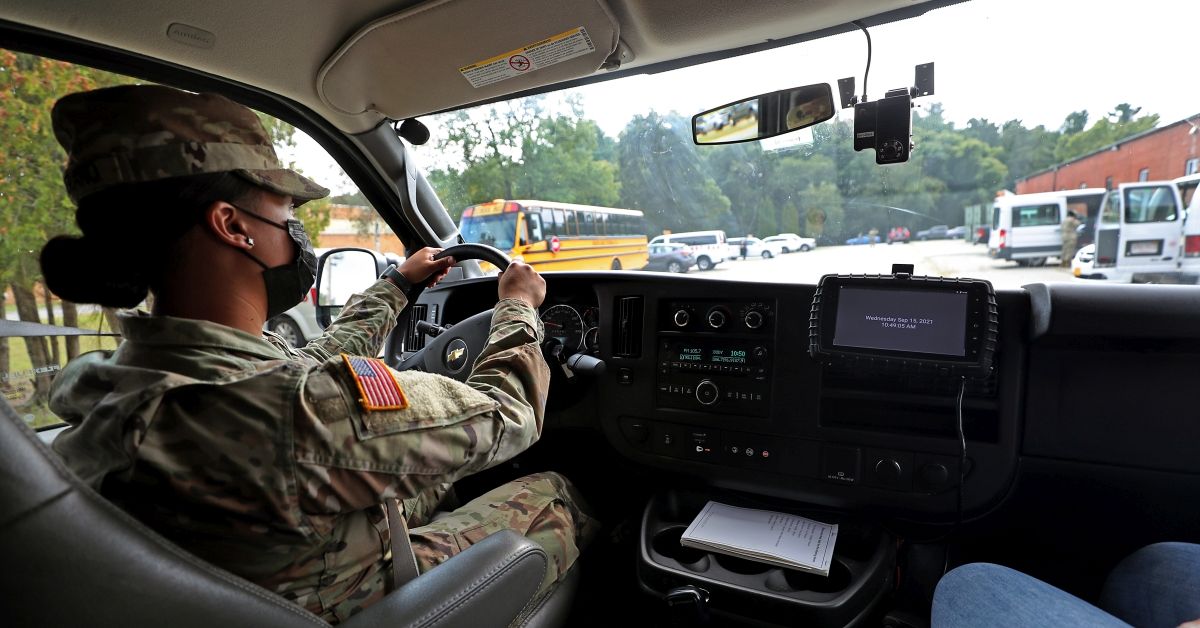 Reading, MA - September 15: National Guard member Vegerano drives a school bus around the base with a safety trainer in Reading, MA on Sept. 15, 2021. About 90 members of the Massachusetts National Guard continue their training in coordination with the Massachusetts Department of Transportation and the NRT Bus company for their school bus transportation mission at the Reading base. (Photo by David L. Ryan/The Boston Globe via Getty Images) (Getty Images)