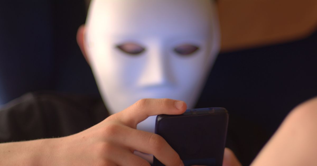 Anonymous teenager with a mask to hide his identity using social networks (Getty Images/Stock photo)