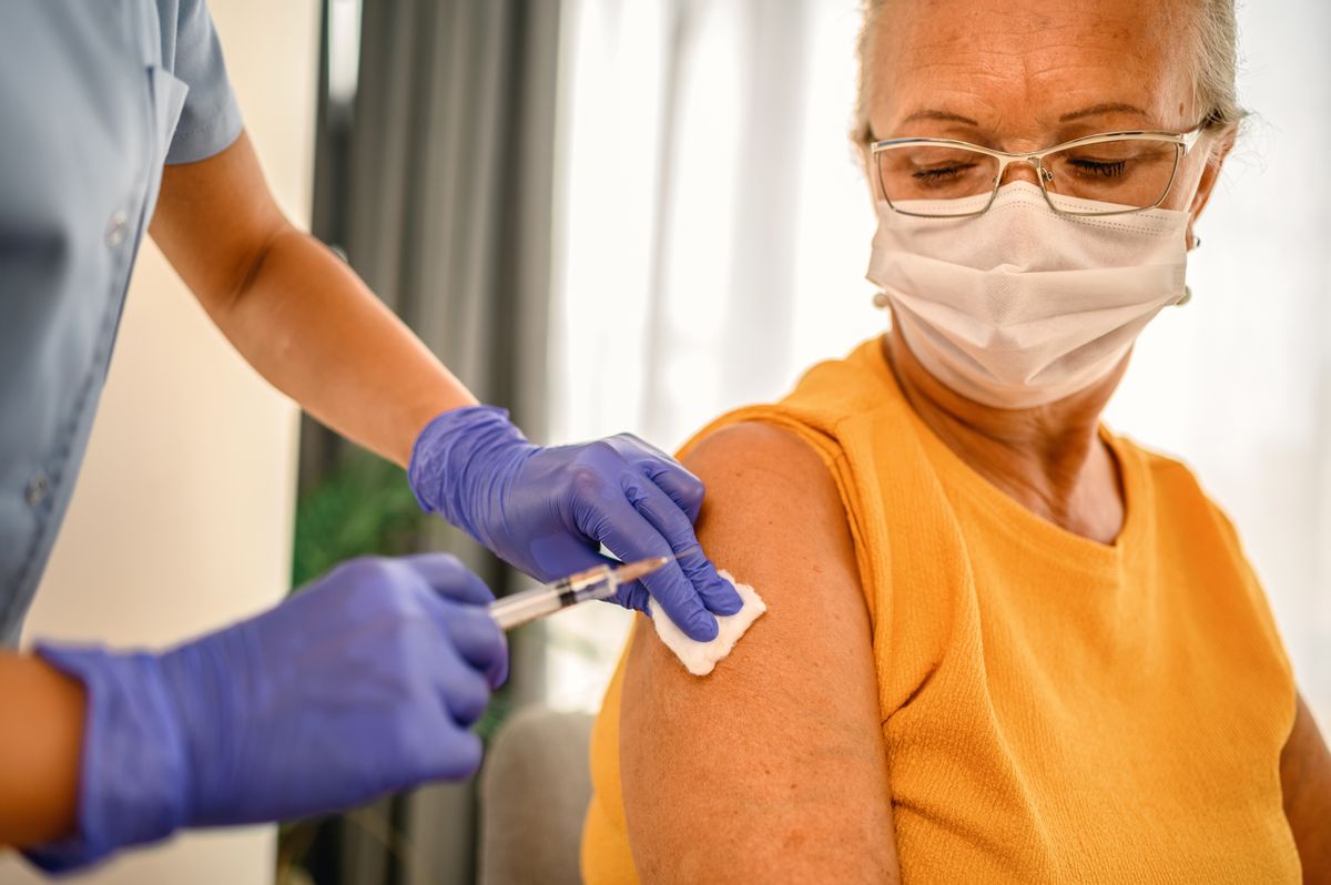 Senior female is about to receive Covid-19 coronavirus vaccine (Getty Images)