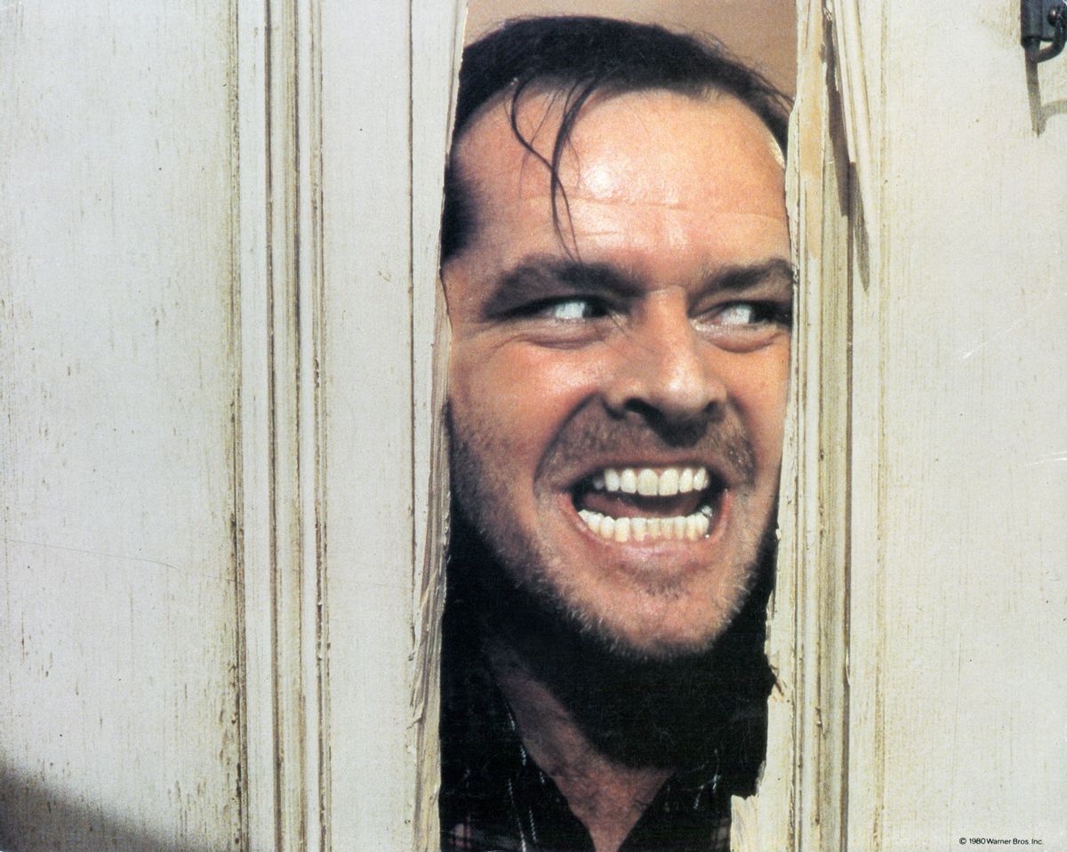 Jack Nicholson peering through axed in door in lobby card for the film 'The Shining', 1980. (Photo by Warner Brothers/Getty Images) (Getty Images)