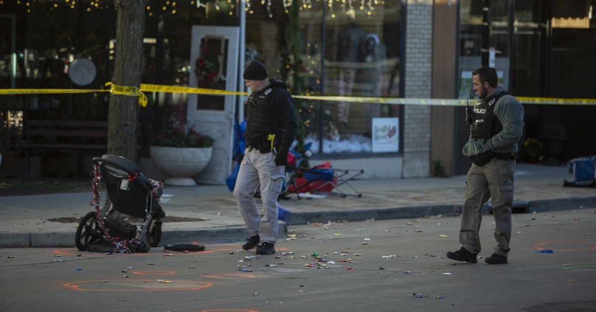WAUKESHA, WI - NOVEMBER 22: Police canvas debris left  following a driver plowing into the Christmas parade on Main Street in downtown November 22, 2021 in Waukesha, Wisconsin. Five people were left dead after a person driving an S.U.V. entered the parade route and proceeded to strike dozens of people. (Photo by Jim Vondruska/Getty Images) (Jim Vondruska/Getty Images)