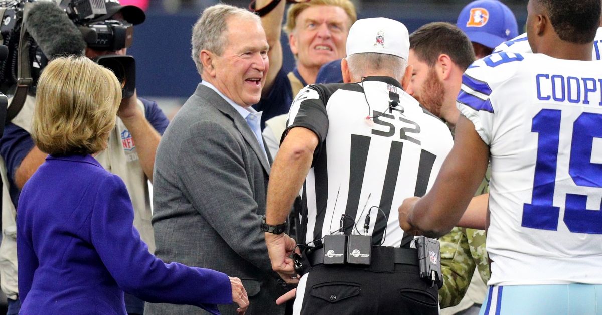ARLINGTON, TEXAS - NOVEMBER 07: (L-R) Former First Lady Laura Bush, Former President George W. Bush, referee Bill Vinovich #52, and Amari Cooper #19 of the Dallas Cowboys after the coin toss before the game against the Denver Broncos at AT&amp;T Stadium on November 07, 2021 in Arlington, Texas. (Photo by Richard Rodriguez/Getty Images) (Richard Rodriguez / Getty Images)