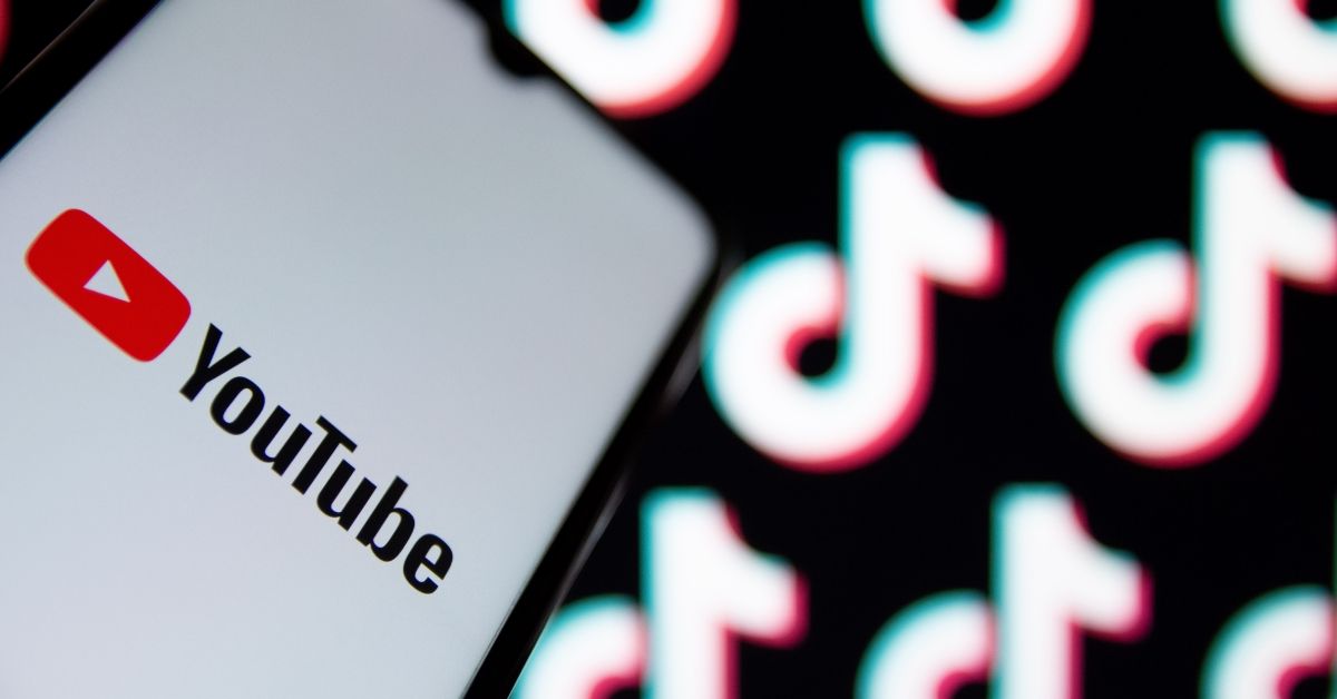 GREECE - 2021/05/11: In this photo illustration a YouTube logo seen displayed on a smartphone screen with TikTok logos in the background. 
YouTube will pay $100 million to creators using its TikTok competitor. (Photo Illustration by Nikolas Joao Kokovlis/SOPA Images/LightRocket via Getty Images) (Getty Images)