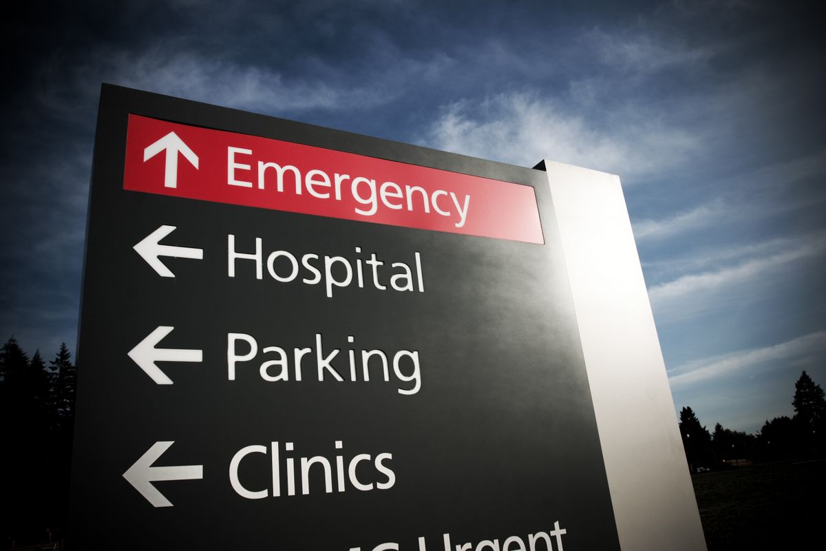 Hospital emergency sign in dramatic light (Donald Gruener/Getty Images)