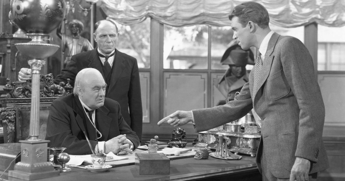 James Stewart, as George Bailey, points at Lionel Barrymore in a scene from It's a Wonderful Life. (Bettmann / Contributor)