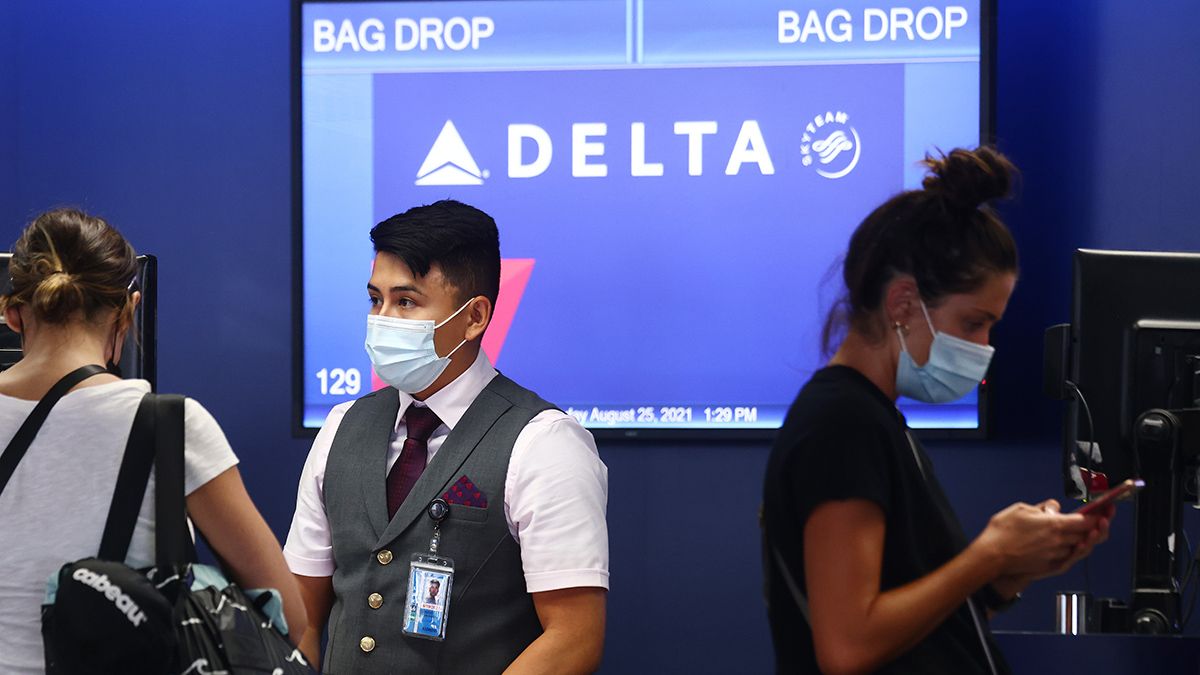 A rumor says that the CDC disregarded health and science and that a letter from the Delta Air Lines CEO was the reason the agency reduced COVID-19 breakthrough isolation and quarantine from 10 days to 5 days. (Mario Tama / Staff)