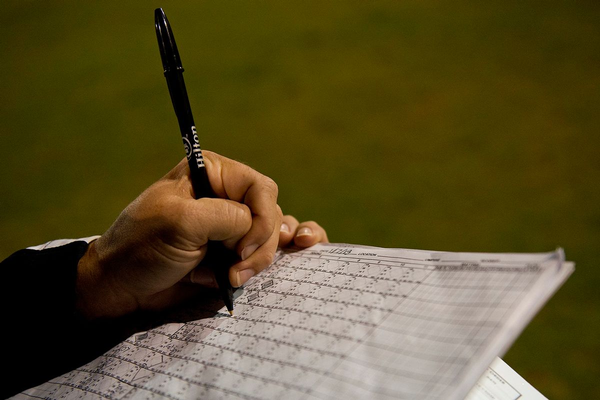 An assistant keeps score of the double-header softball game between the Wounded Warrior Amputee Softball Team and Hickam Airmen Jan. 8, 2013, at Milican Field, Joint Base Pearl Harbor-Hickam, Hawaii. An accurate scorecard helps the Warriors track their statistics throughout the season. The WWAST is comprised of competitive, athletic veterans and active duty servicemembers who have lost limbs during post-9/11 combat operations. The team includes individuals with a variety of amputations of the arm, above knee, below knee, bilateral below knee, and foot. Some are still in the service, while others are attending college thanks to the Post-9/11 GI Bill while others have moved on to new careers. (U.S. Air Force photo/Staff Sgt. Mike Meares) (SSgt Mike Meares/Wikimedia Commons)