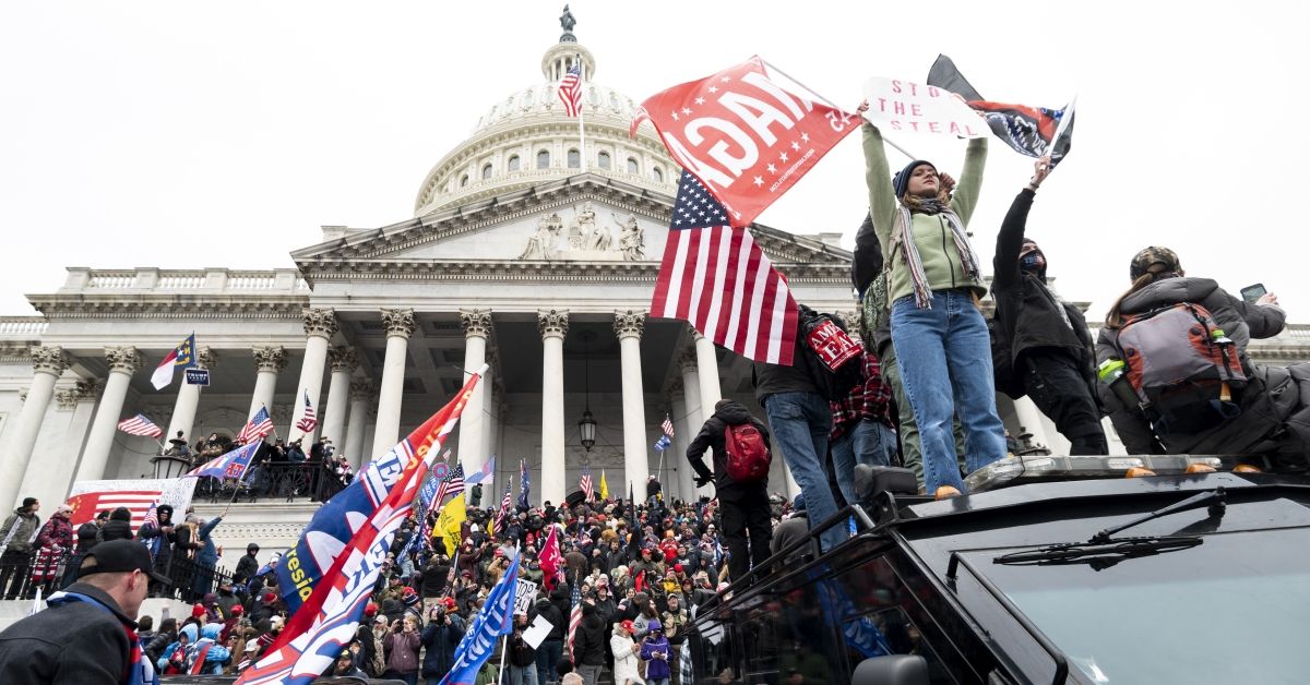 UNITED STATES - JANUARY 6: Trump supporters stand on the U.S. Capitol Police armored vehicle as others take over the steps of the Capitol on Wednesday, Jan. 6, 2021, as the Congress works to certify the electoral college votes. (Photo By Bill Clark/CQ-Roll Call, Inc via Getty Images) (Bill Clark / Getty Images)