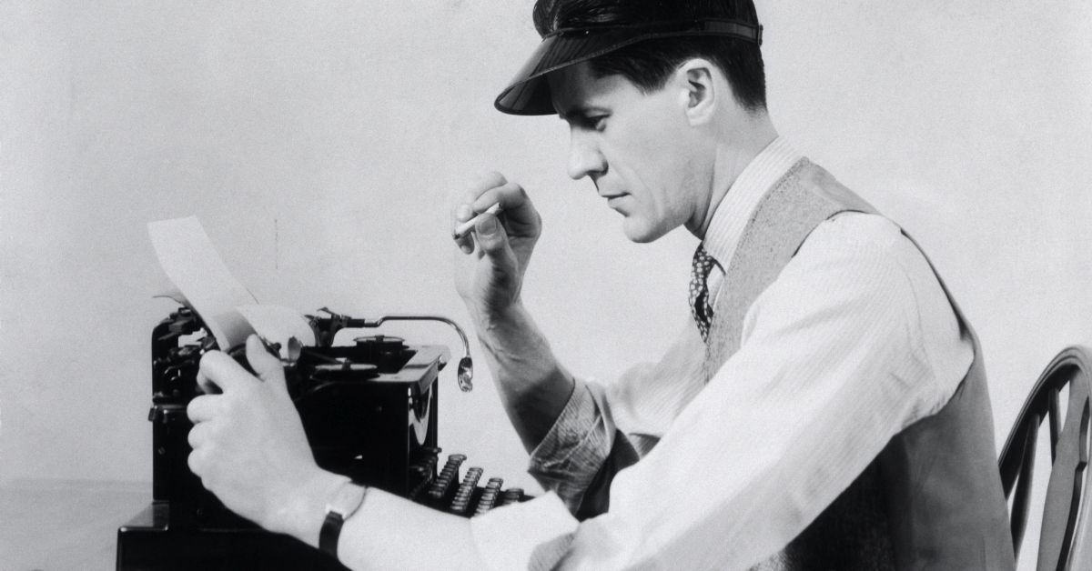 1930s MAN AT THE TYPEWRITER WEARING A VISOR SHIRT TIE AND VEST SMOKING A CIGARETTE WHILE TAKING PAPER FROM THE TYPEWRITER  (Photo by H. Armstrong Roberts/ClassicStock/Getty Images) (H. Armstrong Roberts/ClassicStock/Getty Images)
