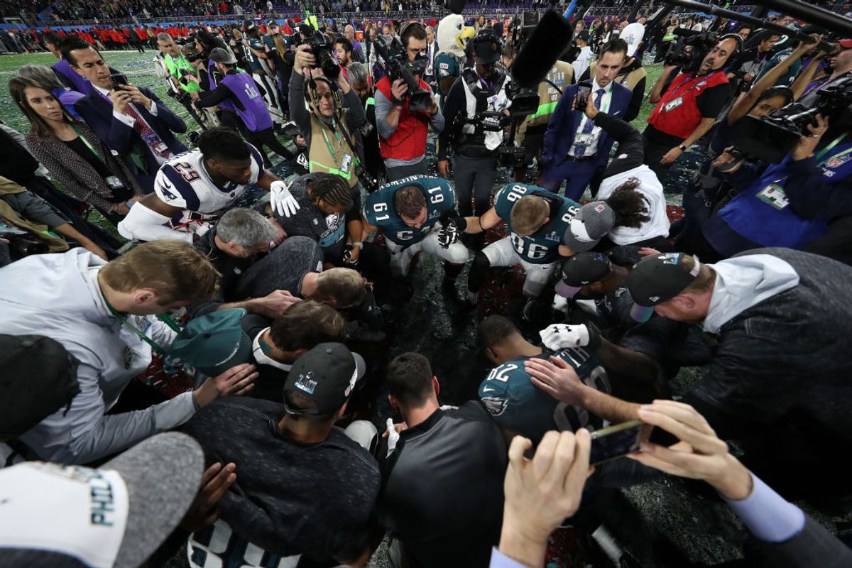 MINNEAPOLIS, MN - FEBRUARY 04:  Members of the Philadelphia Eagles pray following Super Bowl LII at U.S. Bank Stadium on February 4, 2018 in Minneapolis, Minnesota.  (Photo by Rob Carr/Getty Images) (Getty Images/Stock photo)