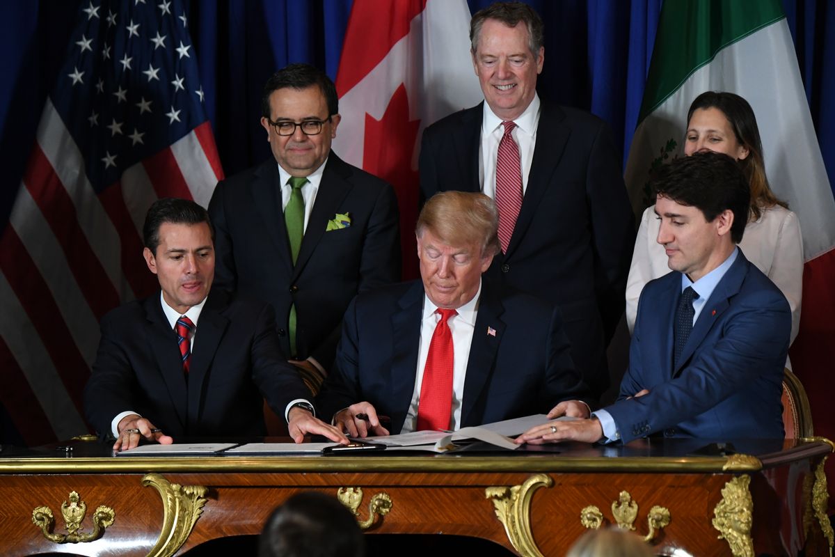 (L to R) Mexican President Enrique Pena Nieto, US President Donald Trump and Canadian Prime Minister Justin Trudeau, sign a new free trade agreement in Buenos Aires, on November 30, 2018, on the sidelines of the G20 Leaders' Summit. - The revamped accord, called the US-Mexico-Canada Agreement (USMCA), looks a lot like the one it replaces. But enough has been tweaked for Trump to declare victory on behalf of the US workers he claims were cheated by NAFTA. (Photo by Martin BERNETTI / AFP)        (Photo credit should read MARTIN BERNETTI/AFP via Getty Images) (Martin Bernetti/AFP via Getty Images)