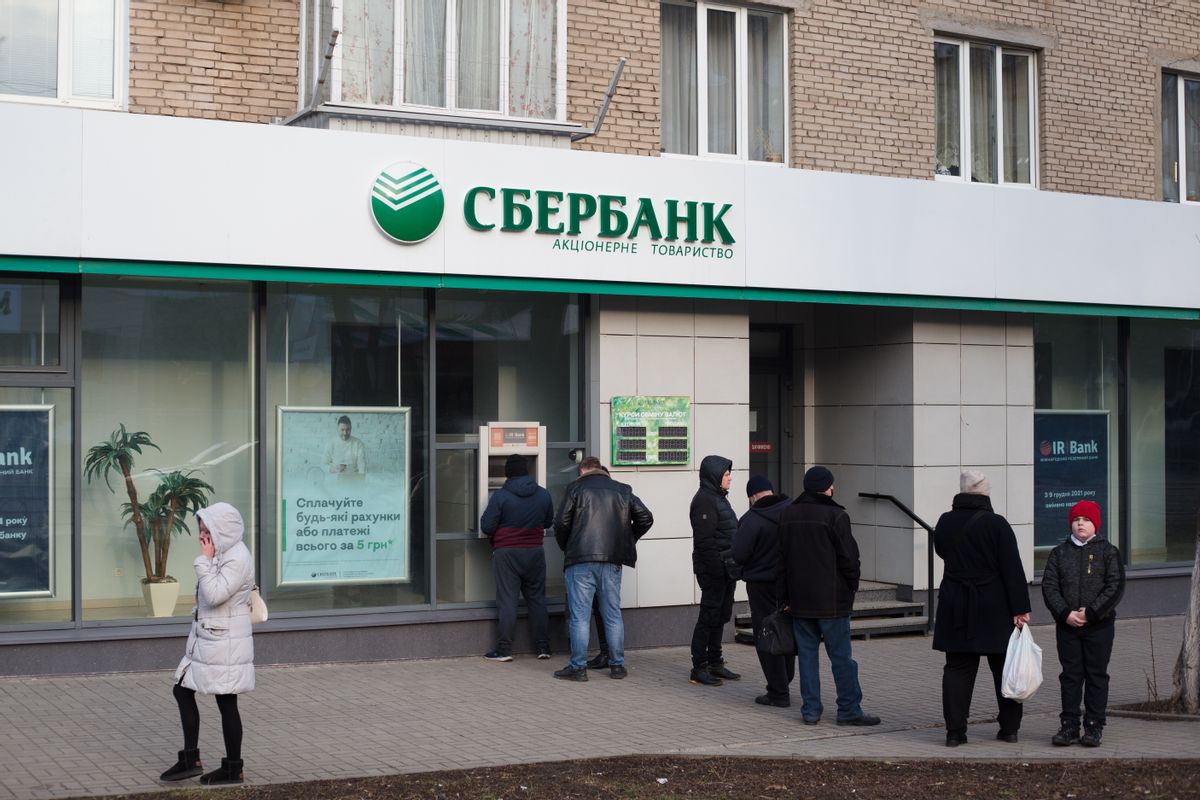 KRAMATORSK, UKRAINE - FEBRUARY 24: Residents wait in line at an ATM of Russian bank Sberbank on February 24, 2022 in Kramatorsk, Ukraine. Overnight, Russia began a large-scale attack on Ukraine, with explosions reported in multiple cities and far outside the restive eastern regions held by Russian-backed rebels. (Photo by Anastasia Vlasova/Getty Images) (Anastasia Vlasova/Getty Images)