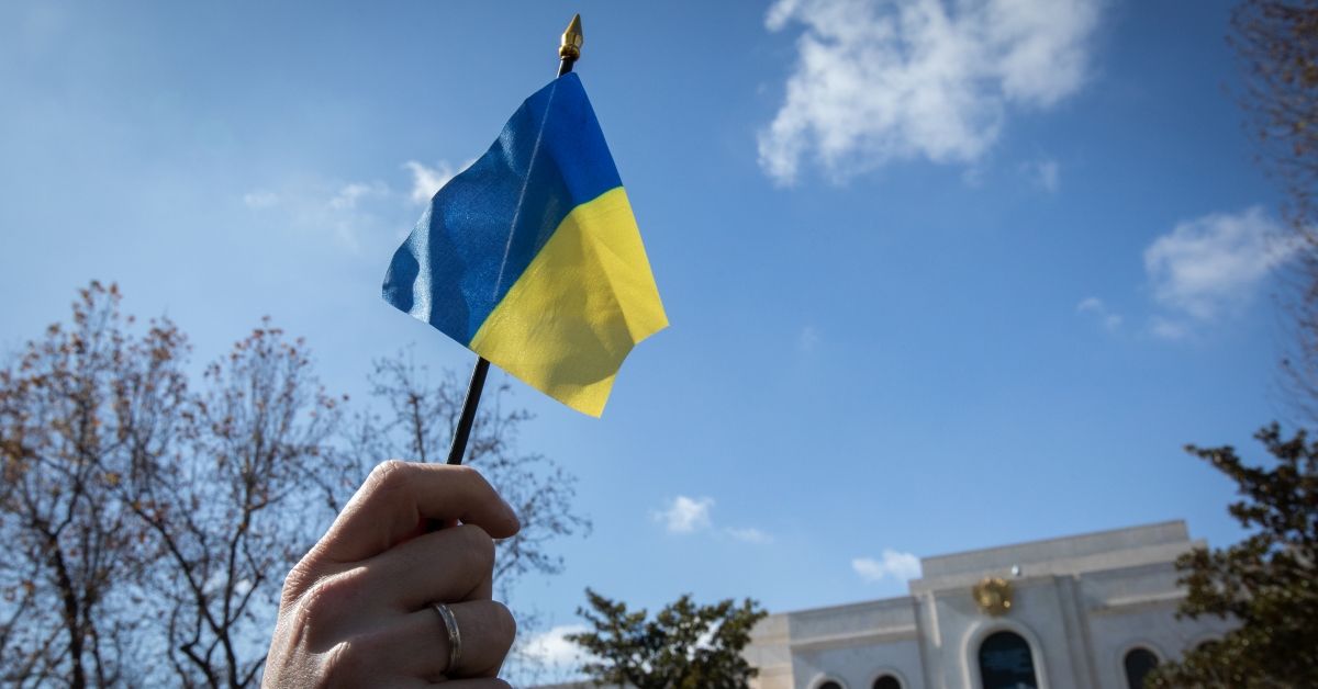 MADRID, SPAIN - FEBRUARY 27:  A protestor holds a Ukrainian flag during a demonstration against the ongoing war in Ukraine in front of the Russian embassy on February 27, 2022 in Madrid, Spain. The NGO Movimiento por la Paz organized the event to protest Russia's invasion of Ukraine.  (Photo by Aldara Zarraoa/Getty Images) (Aldara Zarraoa / Getty Images)
