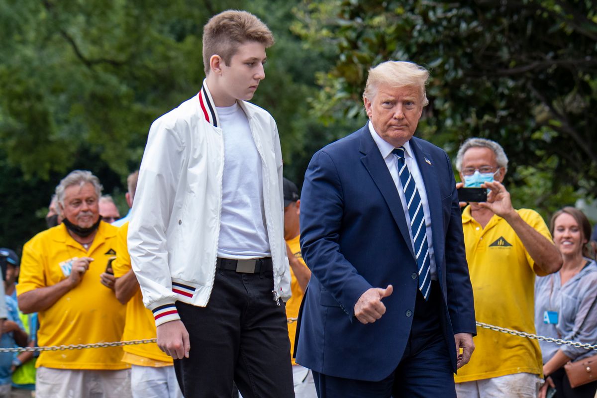 US President Donald Trump returns to the White House with his son Baron (L) after a weekend in Bedminster on August 16, 2020 in Washington. (Photo by Eric BARADAT / AFP) (Photo by ERIC BARADAT/AFP via Getty Images) (Eric Baradat/AFP via Getty Images)