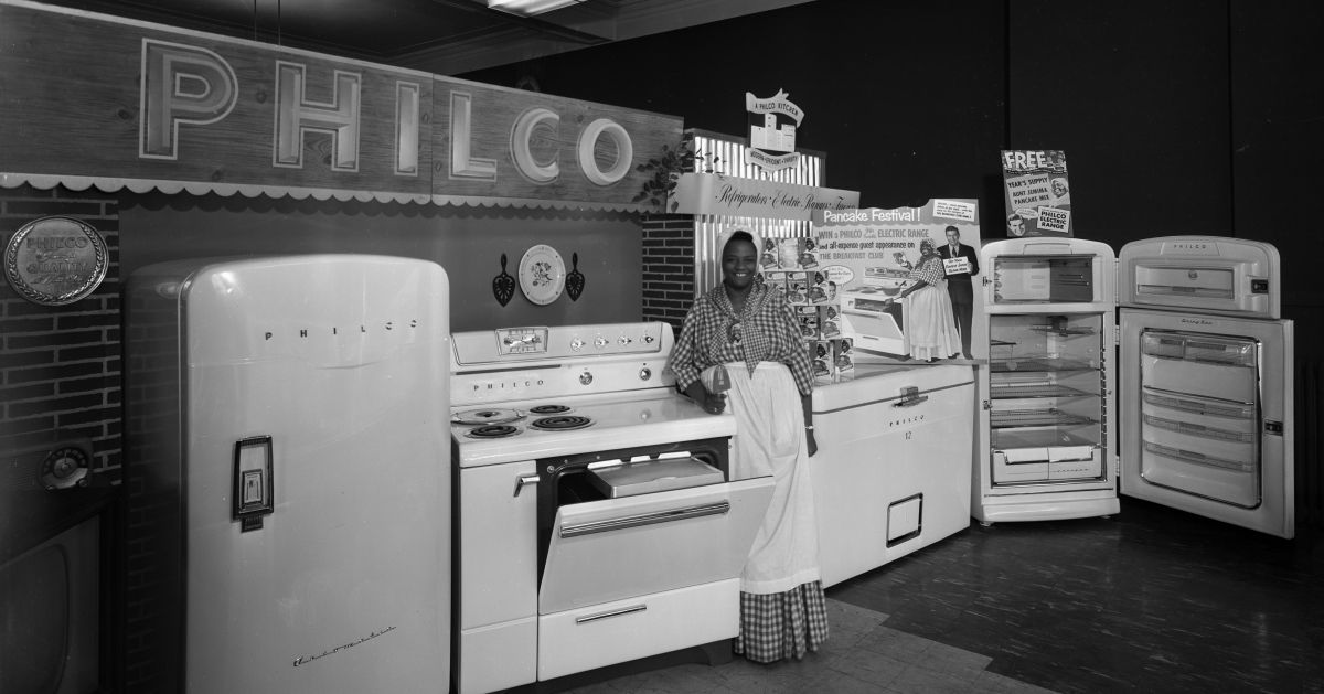 Woman dressed as Aunt Jemima standing with merchandise display, at the Casey and O'Brien Store, 124 West Mifflin Street, featuring Philco appliances including two refrigerators, a chest freezer, and a stove, Madison, Wisconsin, February 27, 1954. (Photo by Angus B. McVicar/Wisconsin Historical Society/Getty Images) (Getty Images)