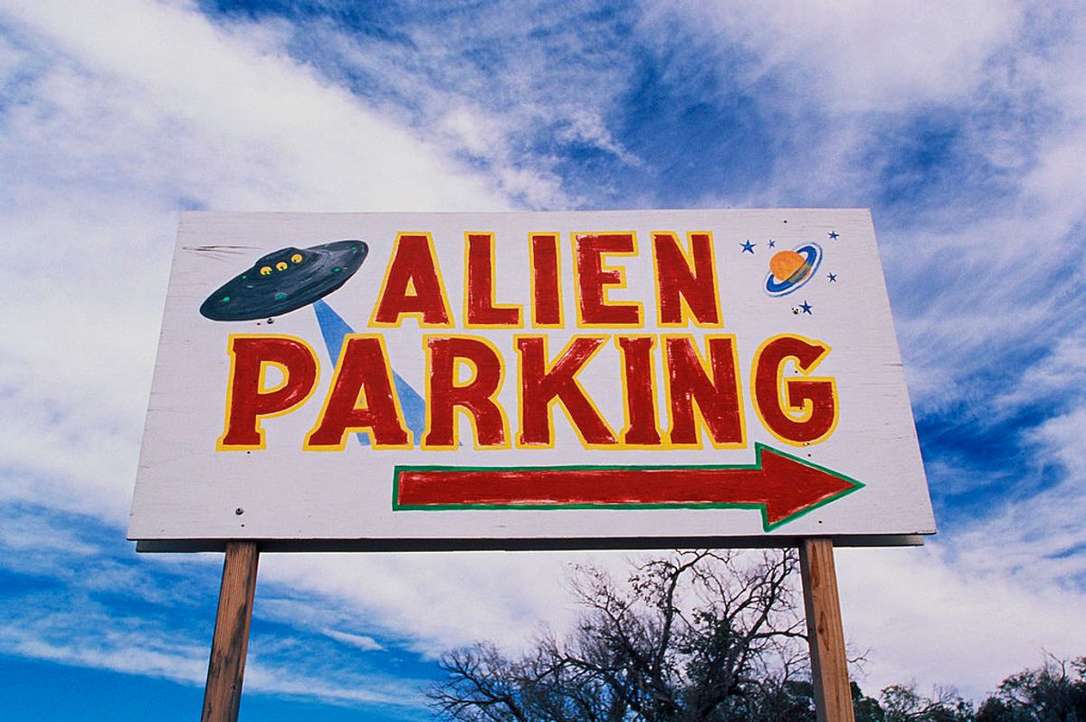 This is a road sign indicating where Alien Parking is, This is the original UFO crash site in Roswell, There are small UFOs on the sign with a large arrow pointing to the right. (Photo by: Joe Sohm/Visions of America/Universal Images Group via Getty Images) (Joe Sohm/Visions of America/Universal Images Group via Getty Images)