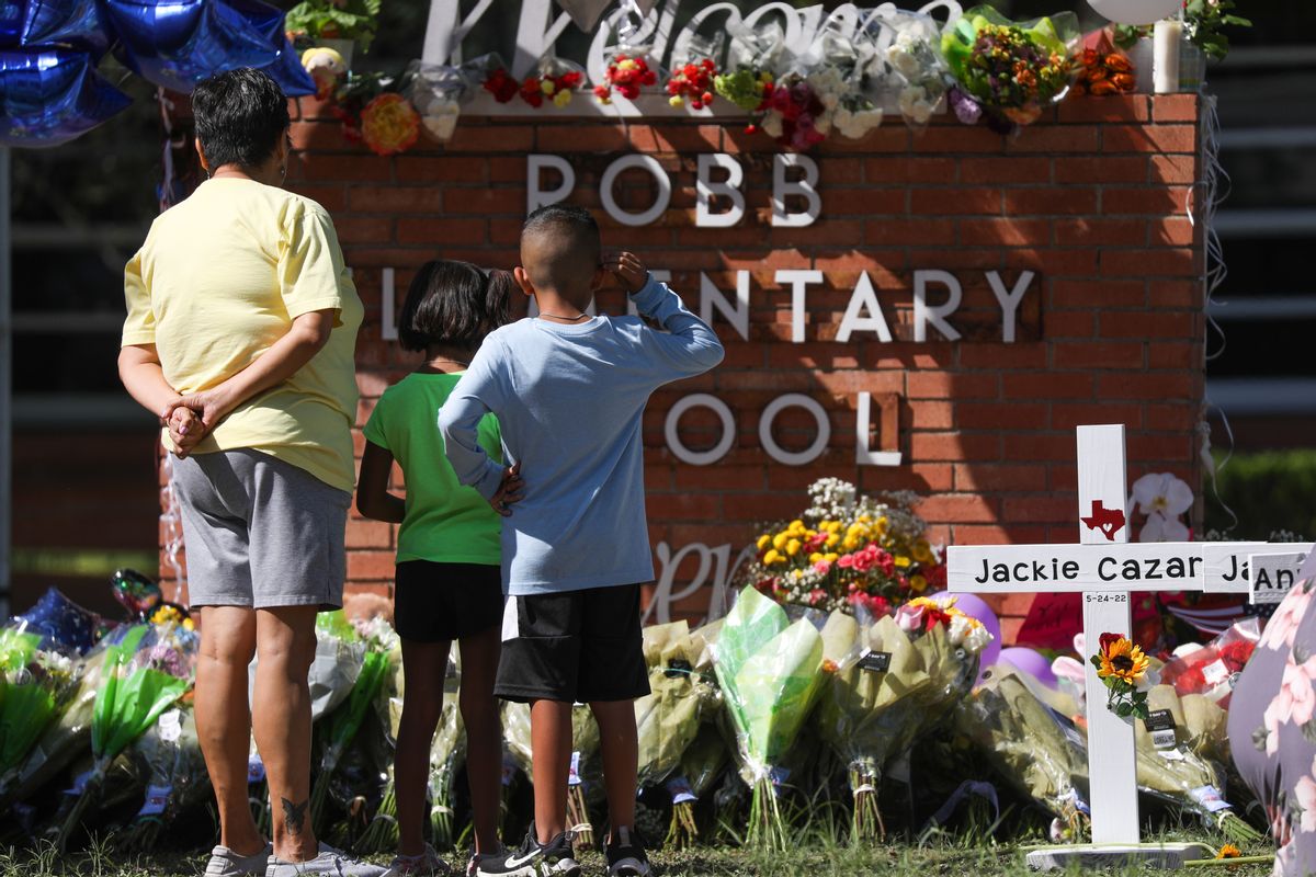 UVALDE,TEXAS, USA - MAY 25: People bring flowers for a makeshift memorial outside Robb Elementary School in Uvalde, Texas, on May 25, 2022. At least 19 students and two adults were killed at an elementary school in the US state of Texas on Wednesday when an 18-year-old gunman opened fire. (Photo by Yasin Ozturk/Anadolu Agency via Getty Images) (Yasin Ozturk/Anadolu Agency via Getty Images)