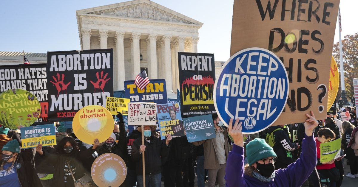 WASHINGTON, DC - DECEMBER 01: Demonstrators gather in front of the U.S. Supreme Court as the justices hear arguments in Dobbs v. Jackson Women's Health, a case about a Mississippi law that bans most abortions after 15 weeks, on December 01, 2021 in Washington, DC. With the addition of conservative justices to the court by former President Donald Trump, experts believe this could be the most important abortion case in decades and could undermine or overturn Roe v. Wade. (Photo by Chip Somodevilla/Getty Images) (Getty Images)