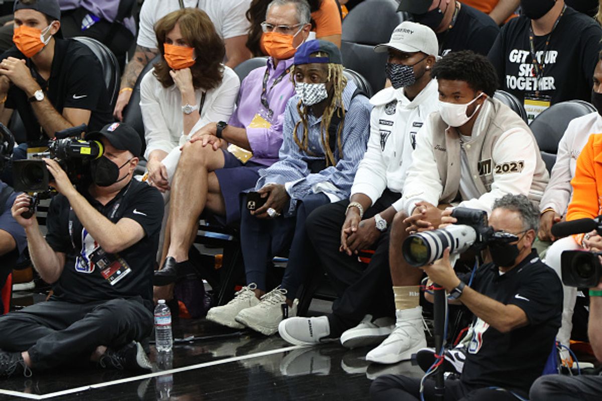 PHOENIX, AZ - July 17: Rapper Lil Wayne attends the Milwaukee Bucks game against the Phoenix Suns during Game Five of the 2021 NBA Finals on July 17, 2021 at Footprint Center in Phoenix, Arizona. NOTE TO USER: User expressly acknowledges and agrees that, by downloading and or using this photograph, user is consenting to the terms and conditions of the Getty Images License Agreement. Mandatory Copyright Notice: Copyright 2021 NBAE (Photo by Joe Murphy/NBAE via Getty Images) (Joe Murphy/NBAE via Getty Images)