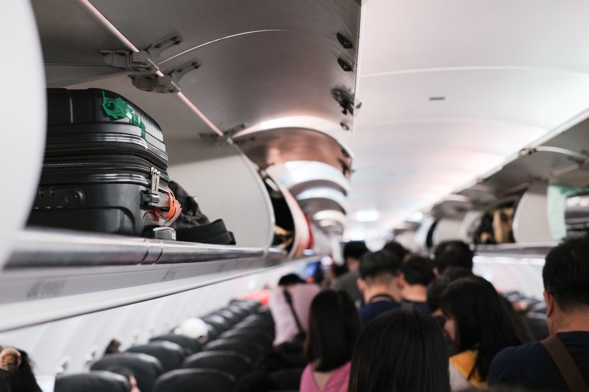 overhead locker on airplane,Passenger put cabin bag cabin on the top shelf. Travel concept (Jacky Enjoy Photography (Getty Images))