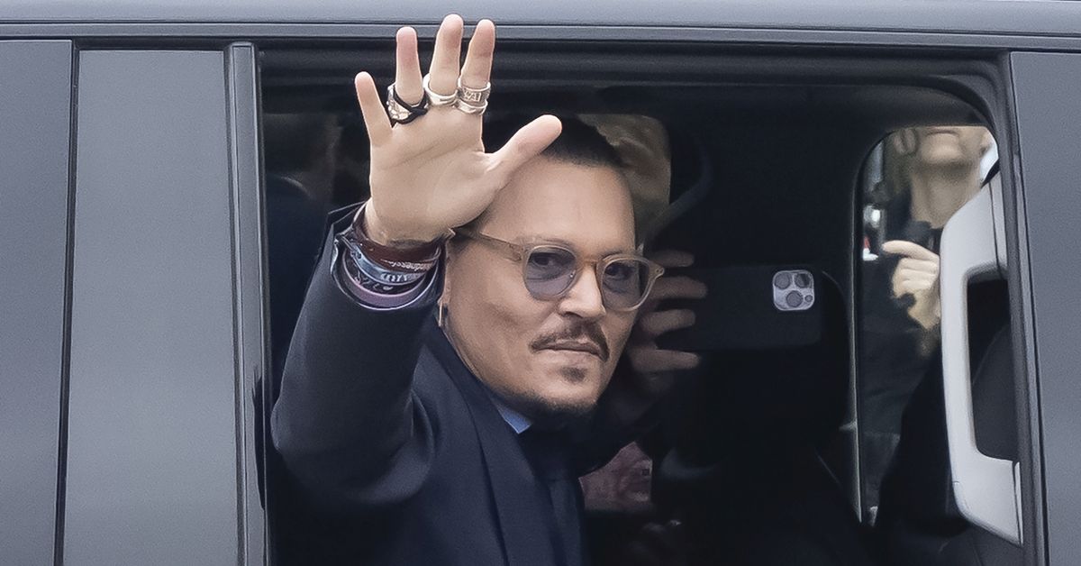 FAIRFAX, VA - MAY 27: (NY &amp; NJ NEWSPAPERS OUT) Johnny Depp waves to his fans as he arrives outside court during the Johnny Depp and Amber Heard civil trial at Fairfax County Circuit Court on May 27, 2022 in Fairfax, Virginia. Depp is seeking $50 million in alleged damages to his career over an op-ed Heard wrote in the Washington Post in 2018.(Photo by Ron Sachs/Consolidated News Pictures/Getty Images) (Getty Images)
