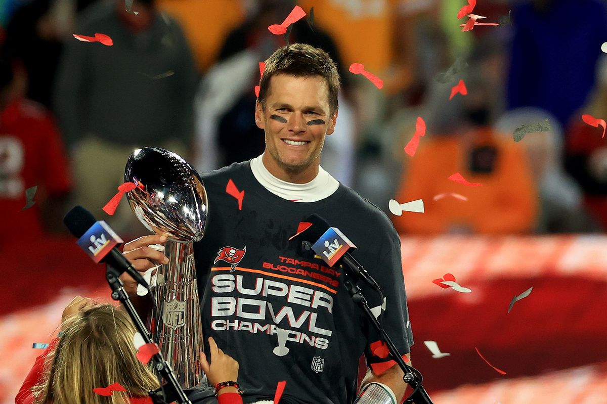 TAMPA, FLORIDA - FEBRUARY 07: Tom Brady #12 of the Tampa Bay Buccaneers hoists the Vince Lombardi Trophy after winning Super Bowl LV at Raymond James Stadium on February 07, 2021 in Tampa, Florida. The Buccaneers defeated the Chiefs 31-9. (Photo by Mike Ehrmann/Getty Images) (Mike Ehrmann/Getty Images)