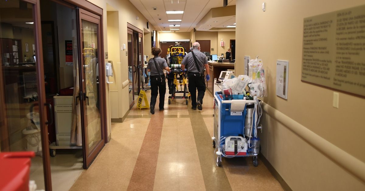 CRAIG, COLORADO - JULY 20: Brooks Bingman, a paramedic in Moffat County, left, and Clay Trevenen, EMT, bring a patient into the ER at Memorial Hospital on July 20, 2021 in Craig, Colorado. (Photo by RJ Sangosti/MediaNews Group/The Denver Post via Getty Images) (Getty Images)