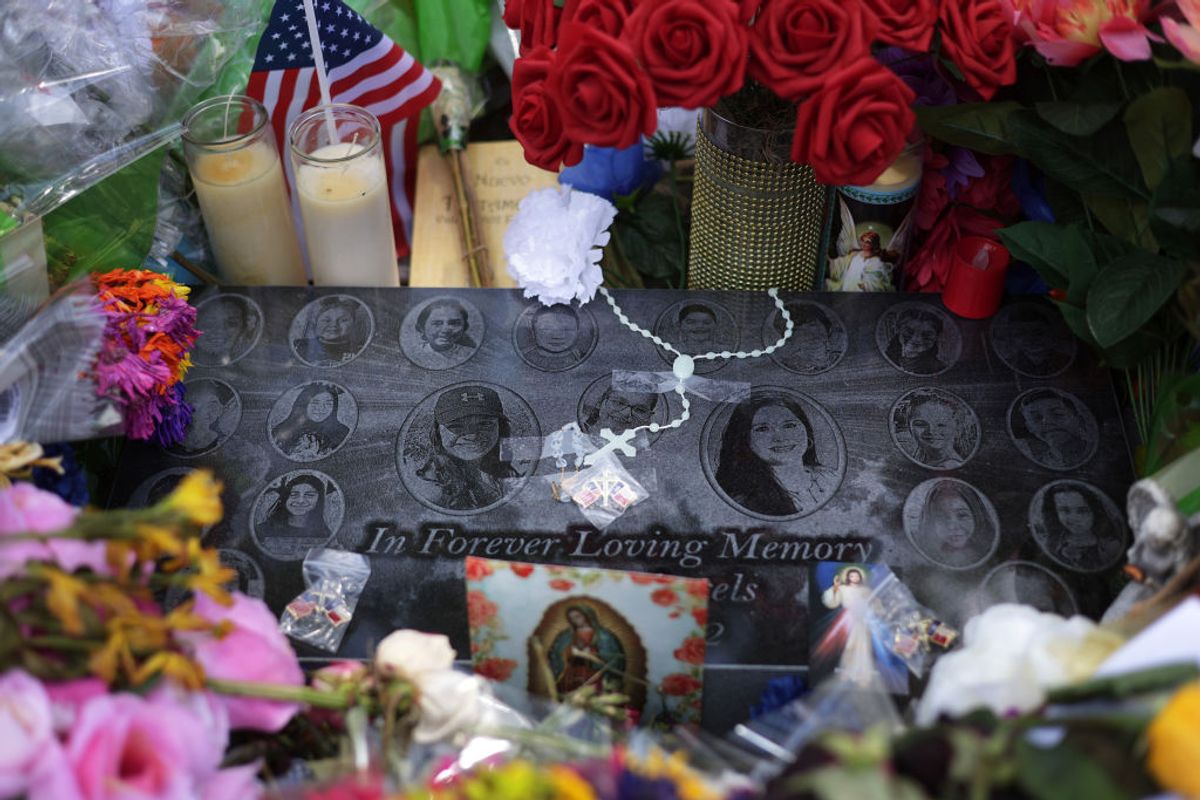 UVALDE, TEXAS - JUNE 03:  Flowers and photographs are placed at a memorial dedicated to the victims of the mass shooting at Robb Elementary School on June 3, 2022 in Uvalde, Texas. 19 students and two teachers were killed on May 24 after an 18-year-old gunman opened fire inside the school. Wakes and funerals for the 21 victims are scheduled throughout the week. (Photo by Alex Wong/Getty Images) (Alex Wong/Getty Images)